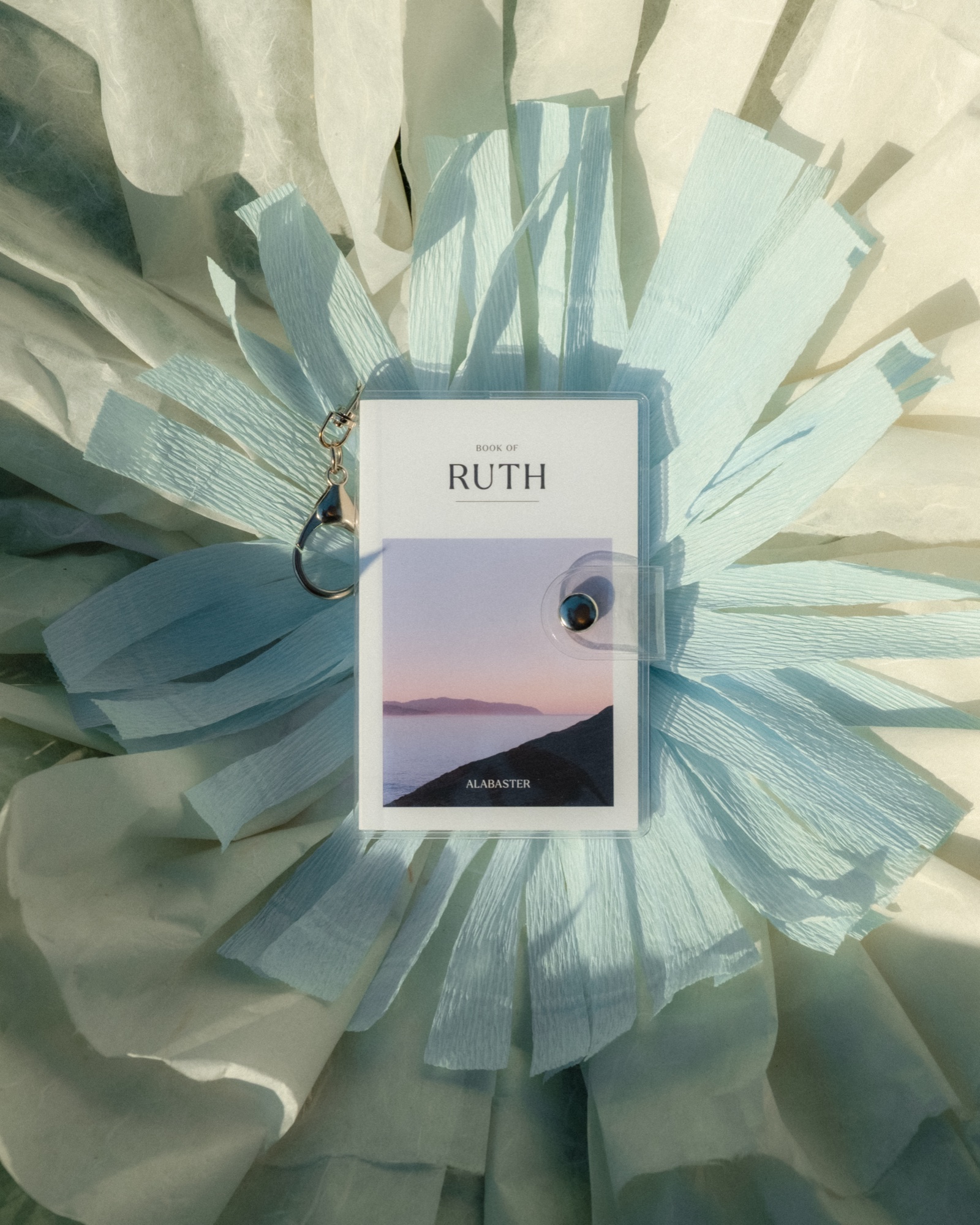 Mini Bibles: Lifestyle, Mother's Day 2026 shoot, Book of Ruth in its pouch on a paper flower